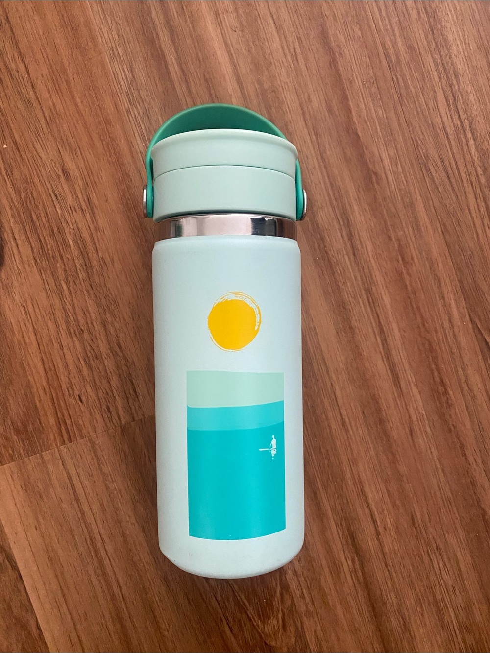 Hydro Flask mint green water bottle with teal and yellow graphic